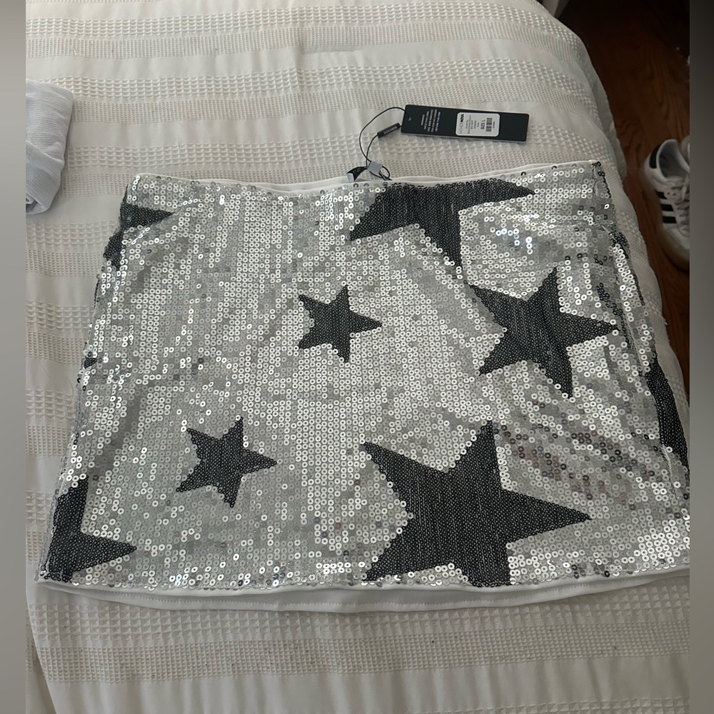 Fashion Nova Silver Sequin Mini Skirt with Black Star Accents